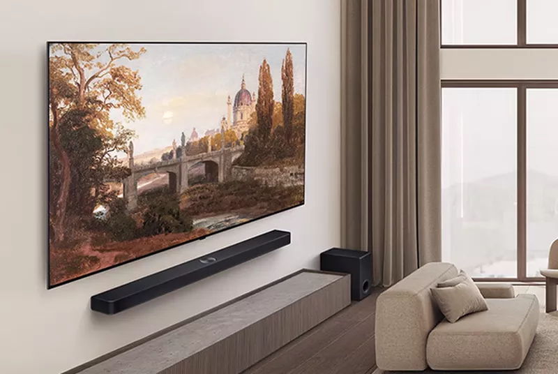 a light living room with a large lg b5 tv on the wall